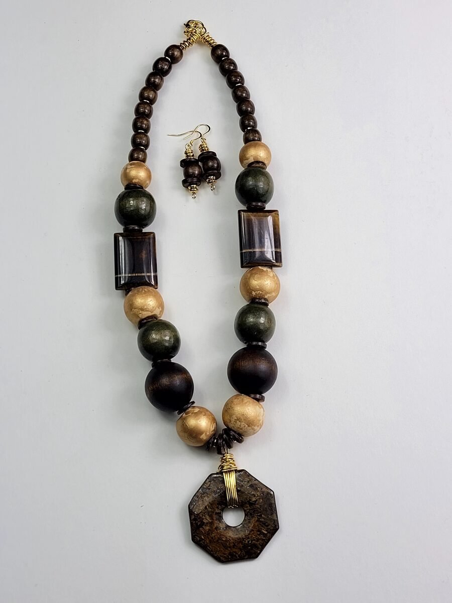 Brown, gold, and olive green beaded necklace with earthy tones.