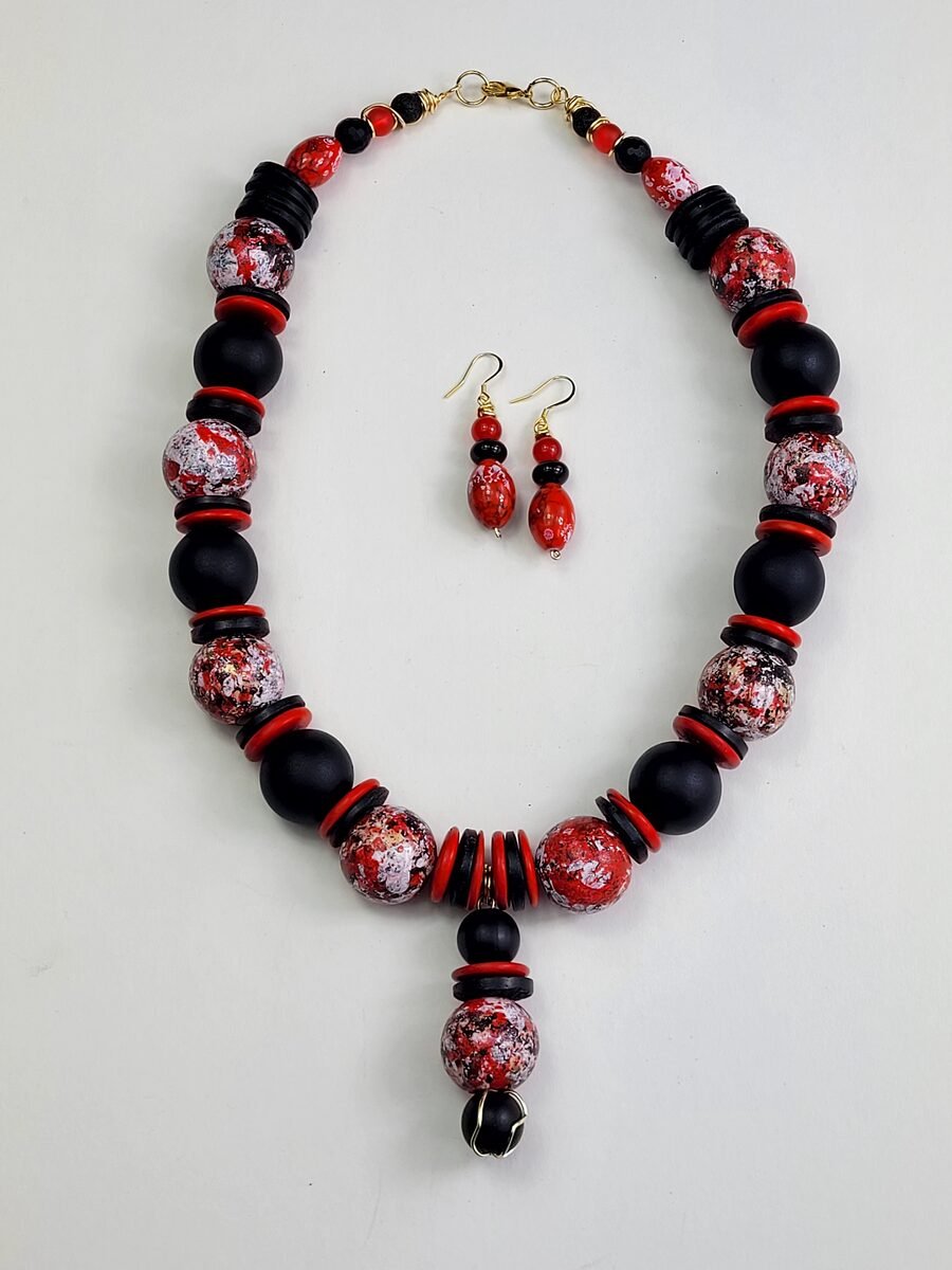 Red, white, and black splatter-pattern beaded necklace.