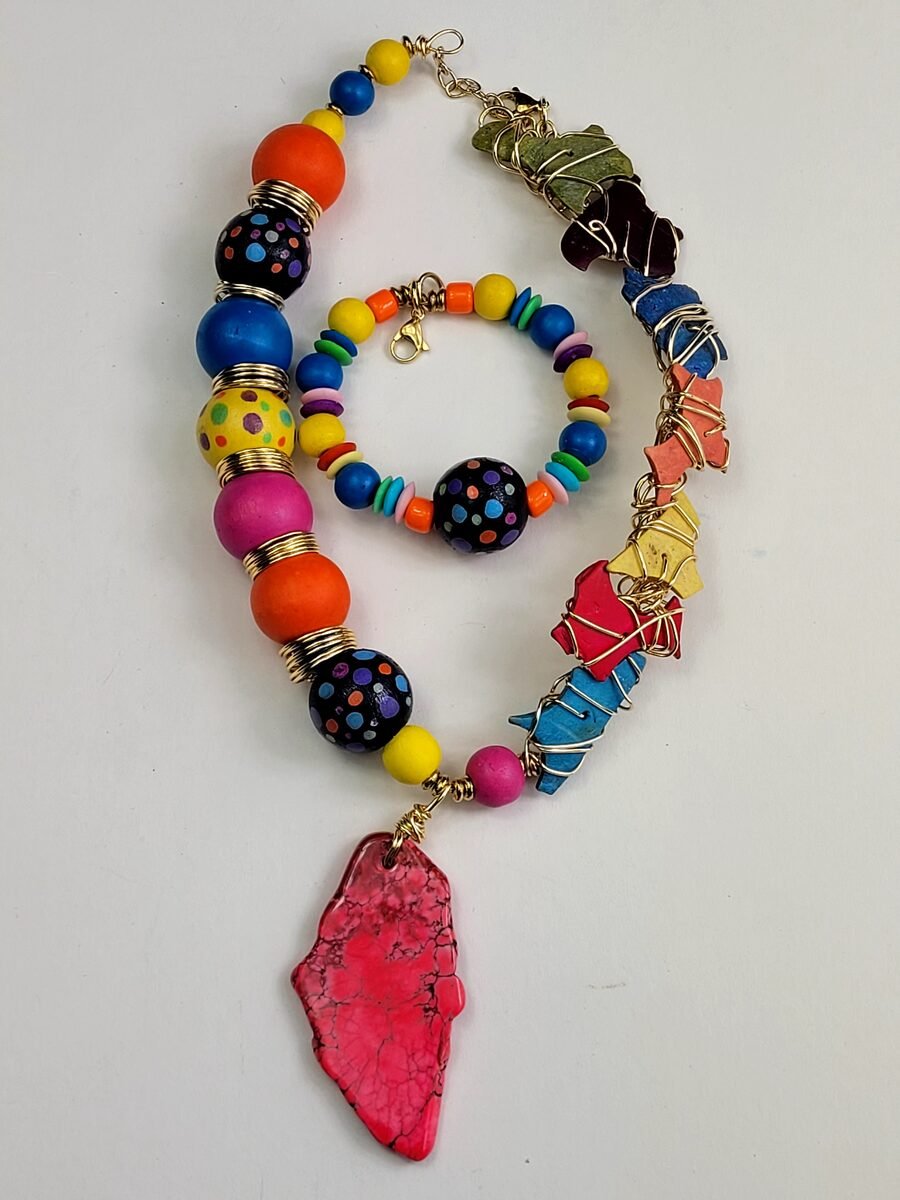 Rainbow and pink beaded necklace with wire accents.