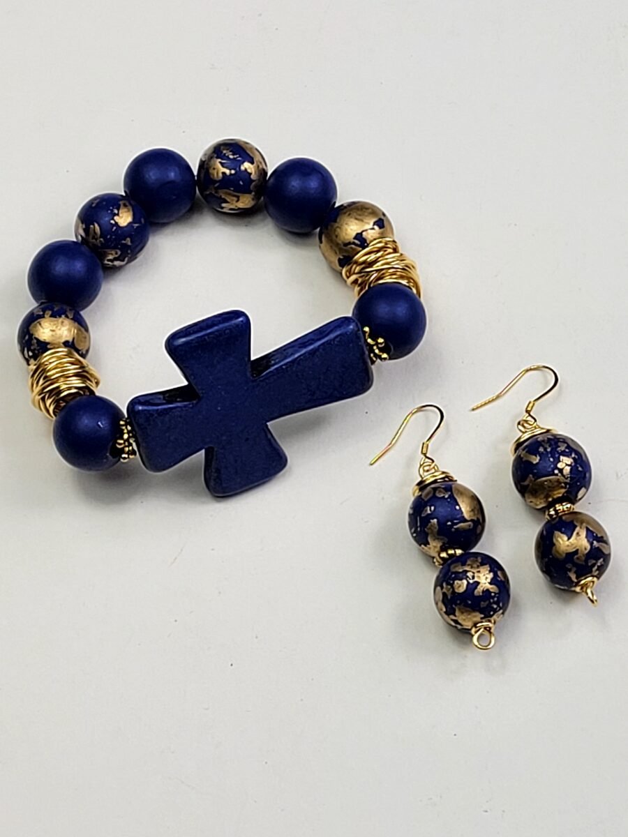 Navy blue beaded bracelet with a cross charm.