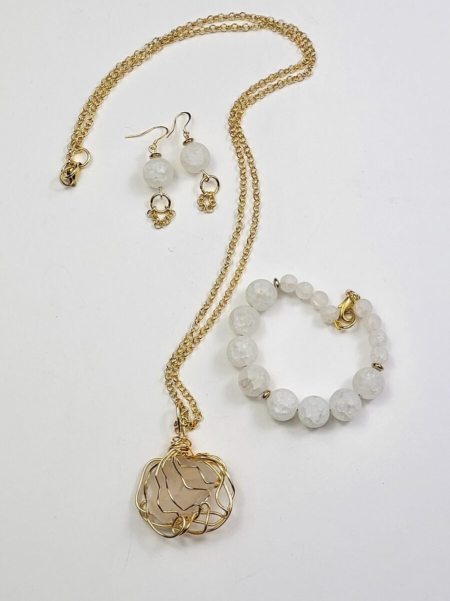 White quartz beaded necklace with a gold chain.