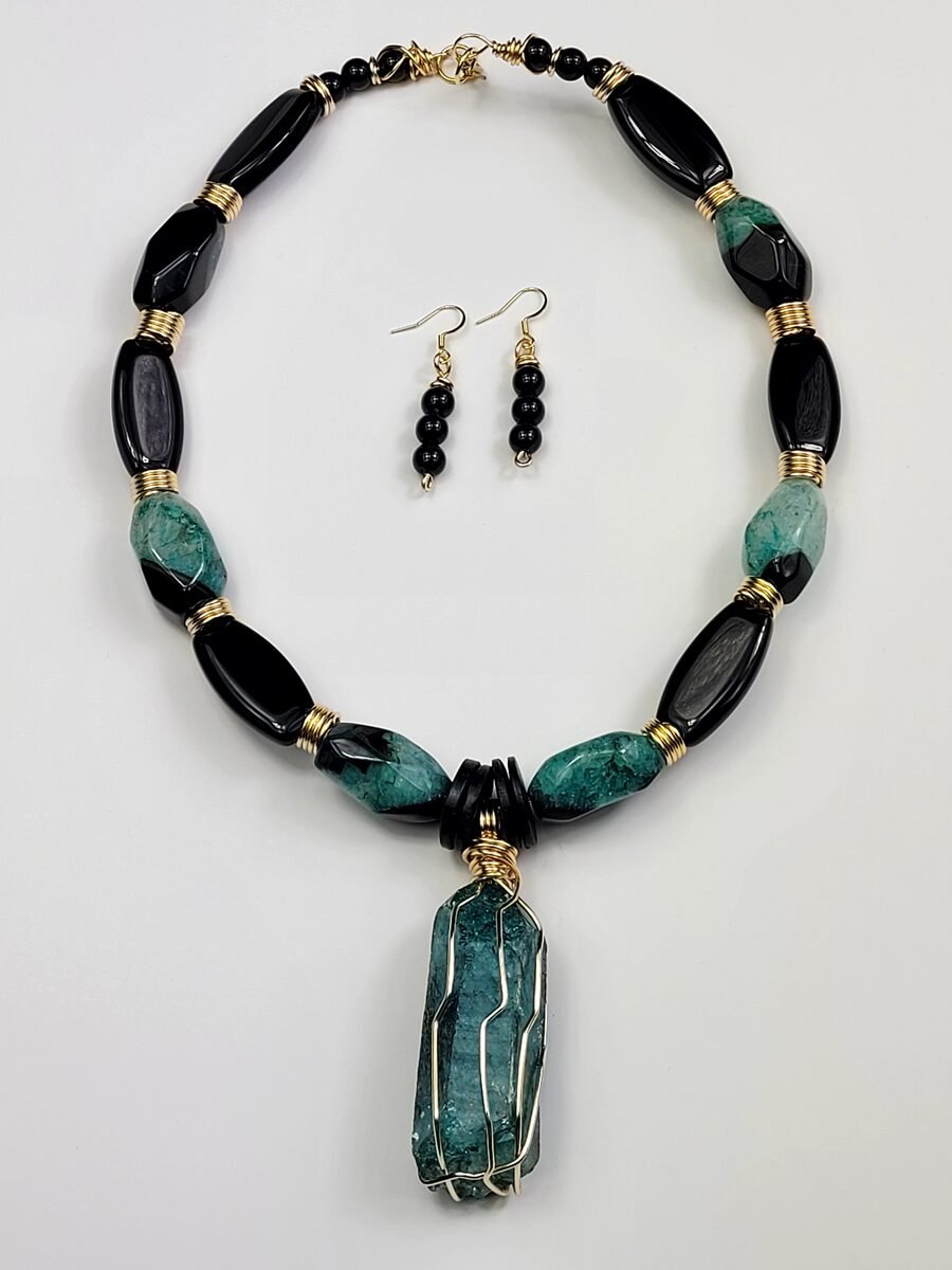 Teal and black wire-wrapped beaded necklace.
